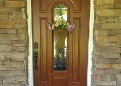 front door with flowers